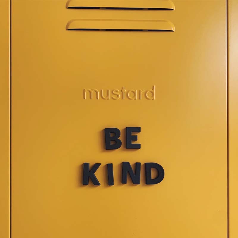 Be kind message written in black magnet letters on a Mustard Made metal locker