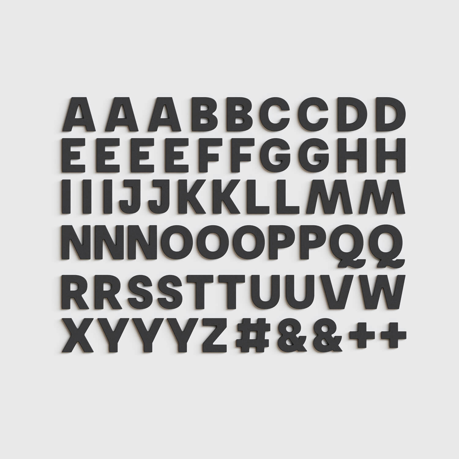 Full set of 60 black Wordbits alphabet magnet letters and symbols laid out neatly on a grey background