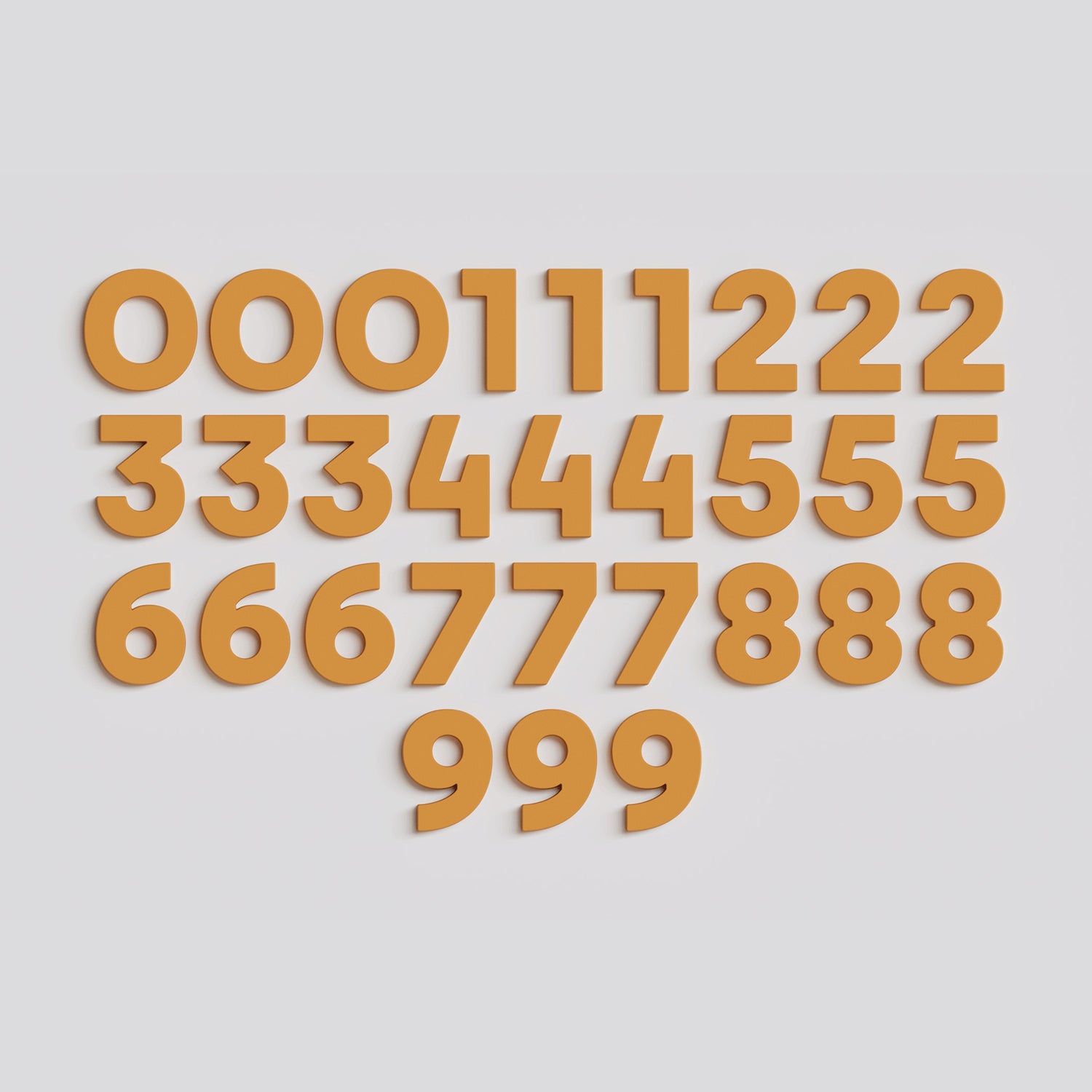Full set of 30 mustard Wordbits number magnet letters and symbols laid out neatly on a grey background